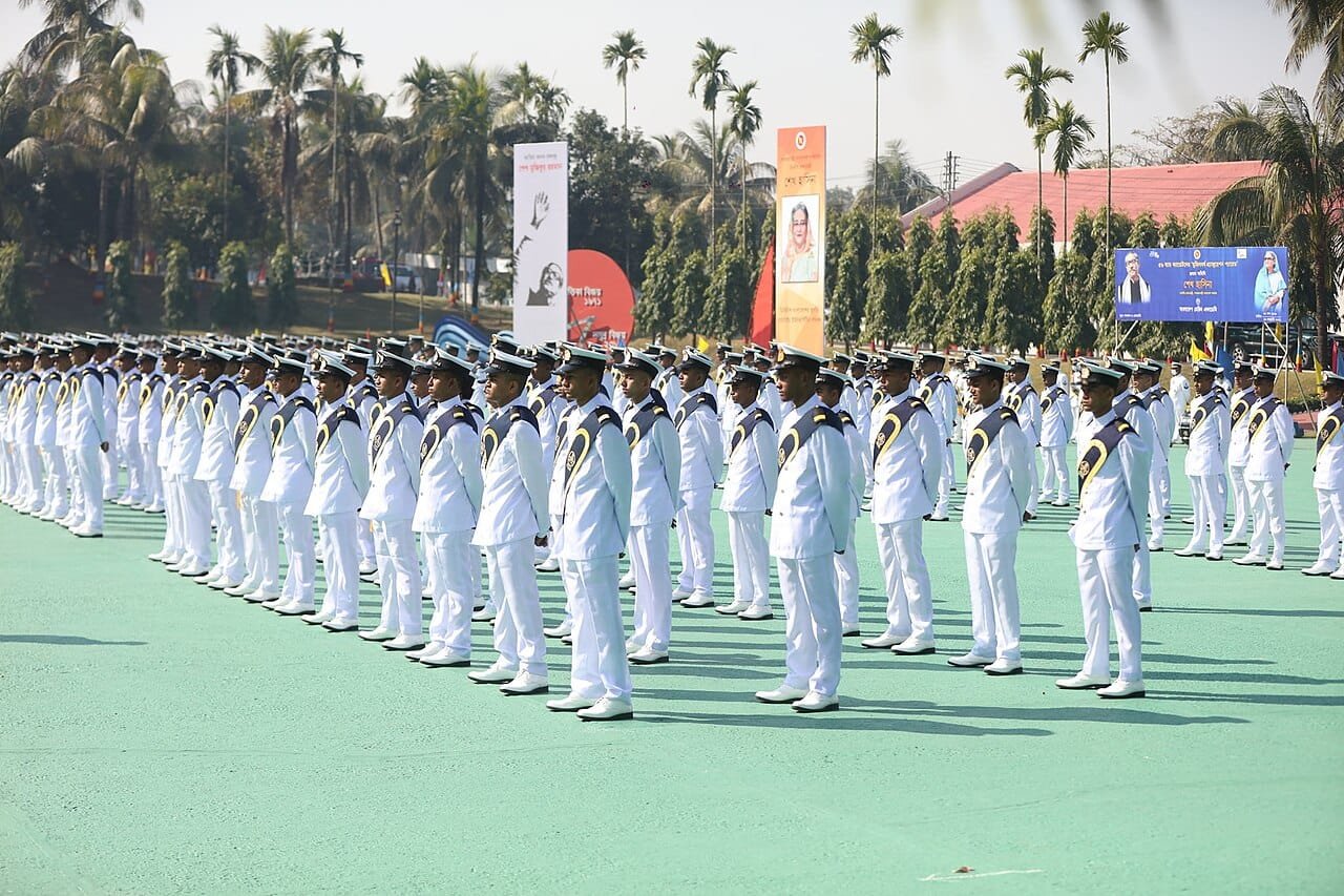 Ranks of marine cadets standing at attention in dress whites